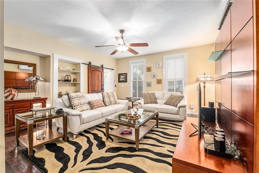 44 Southeast 8th Court Ocala, FL 34471 - Photo 28 of 87 a living room with furniture a flat screen tv and a window