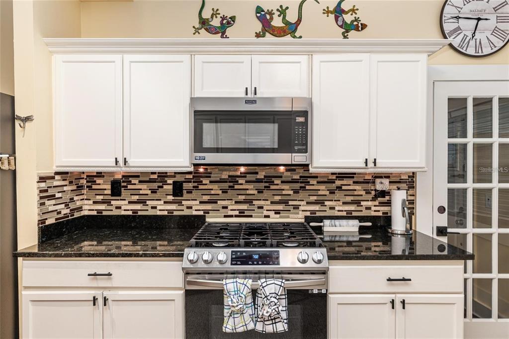 44 Southeast 8th Court Ocala, FL 34471 - Photo 39 of 87 a kitchen with cabinets and appliances