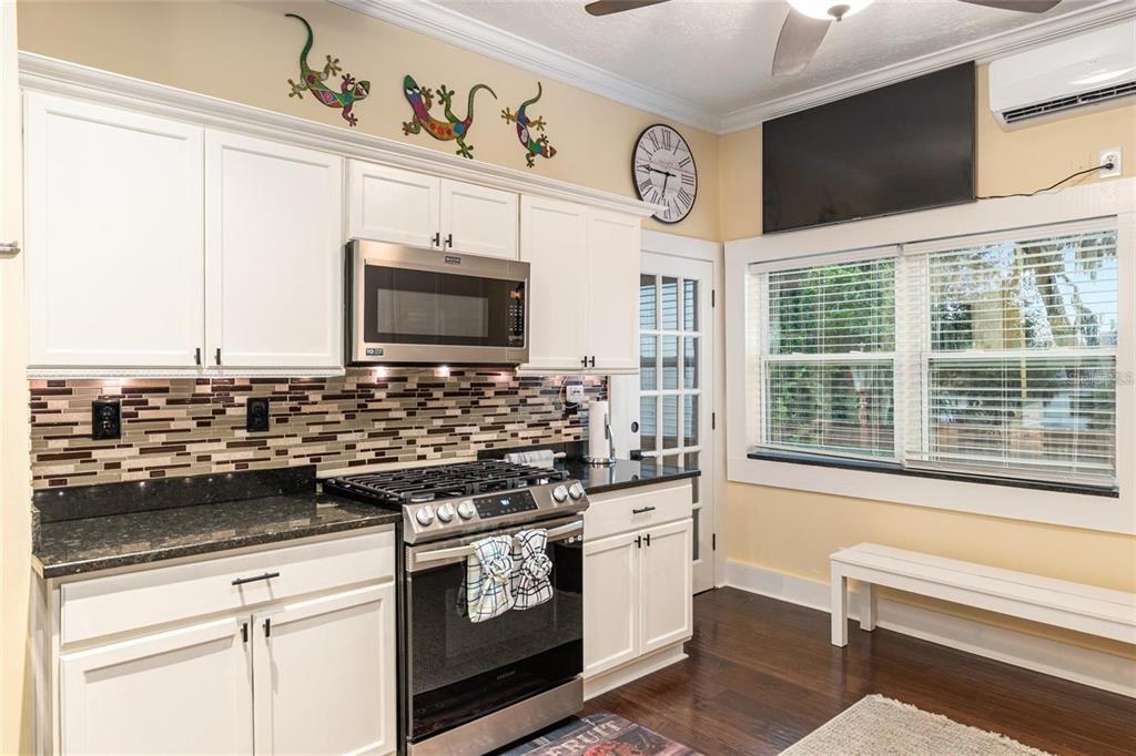 44 Southeast 8th Court Ocala, FL 34471 - Photo 40 of 87 a kitchen with stainless steel appliances a stove and a microwave