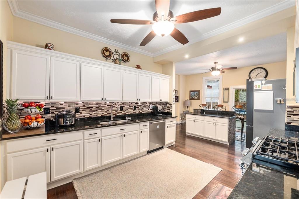 44 Southeast 8th Court Ocala, FL 34471 - Photo 41 of 87 a kitchen with stainless steel appliances granite countertop a sink and cabinets
