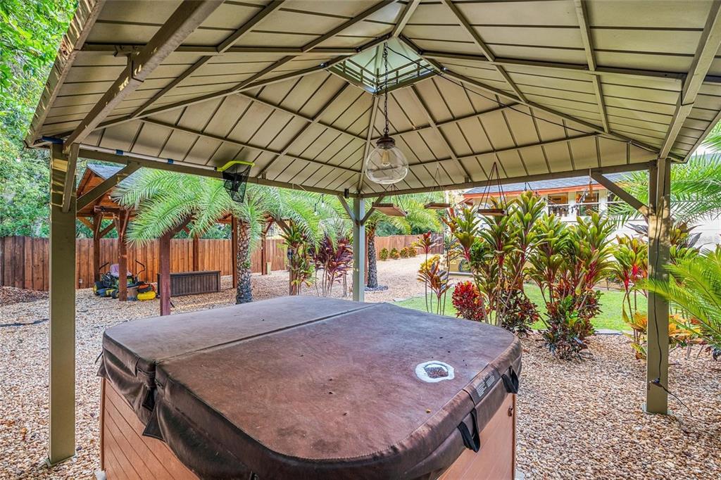 44 Southeast 8th Court Ocala, FL 34471 - Photo 65 of 87 a view of outdoor space with a table and chairs under an umbrella