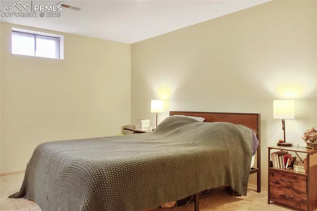 a bedroom with a bed and a closet