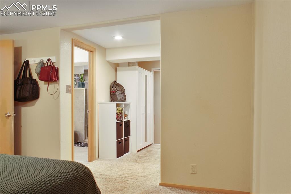 609 Placid Road Colorado Springs, CO 80910 - Photo 14 of 28 a bedroom with a bed and a closet