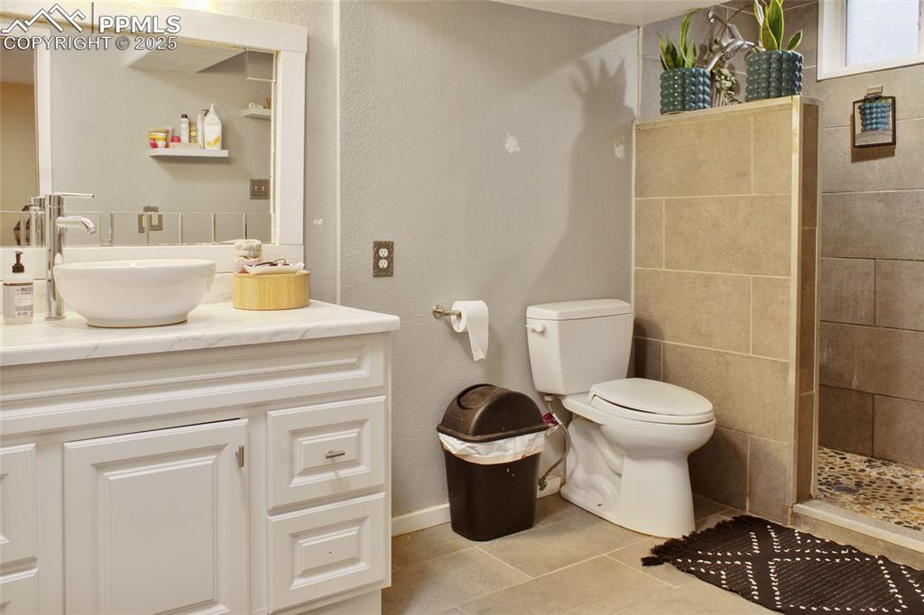 609 Placid Road Colorado Springs, CO 80910 - Photo 15 of 28 a bathroom with a toilet and a sink