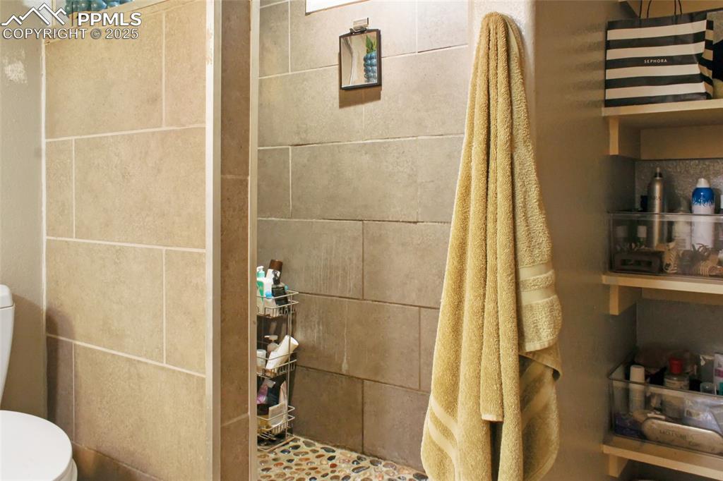 609 Placid Road Colorado Springs, CO 80910 - Photo 16 of 28 a bathroom with a shower