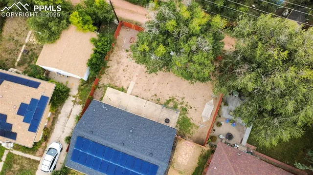 a view of a backyard of the house