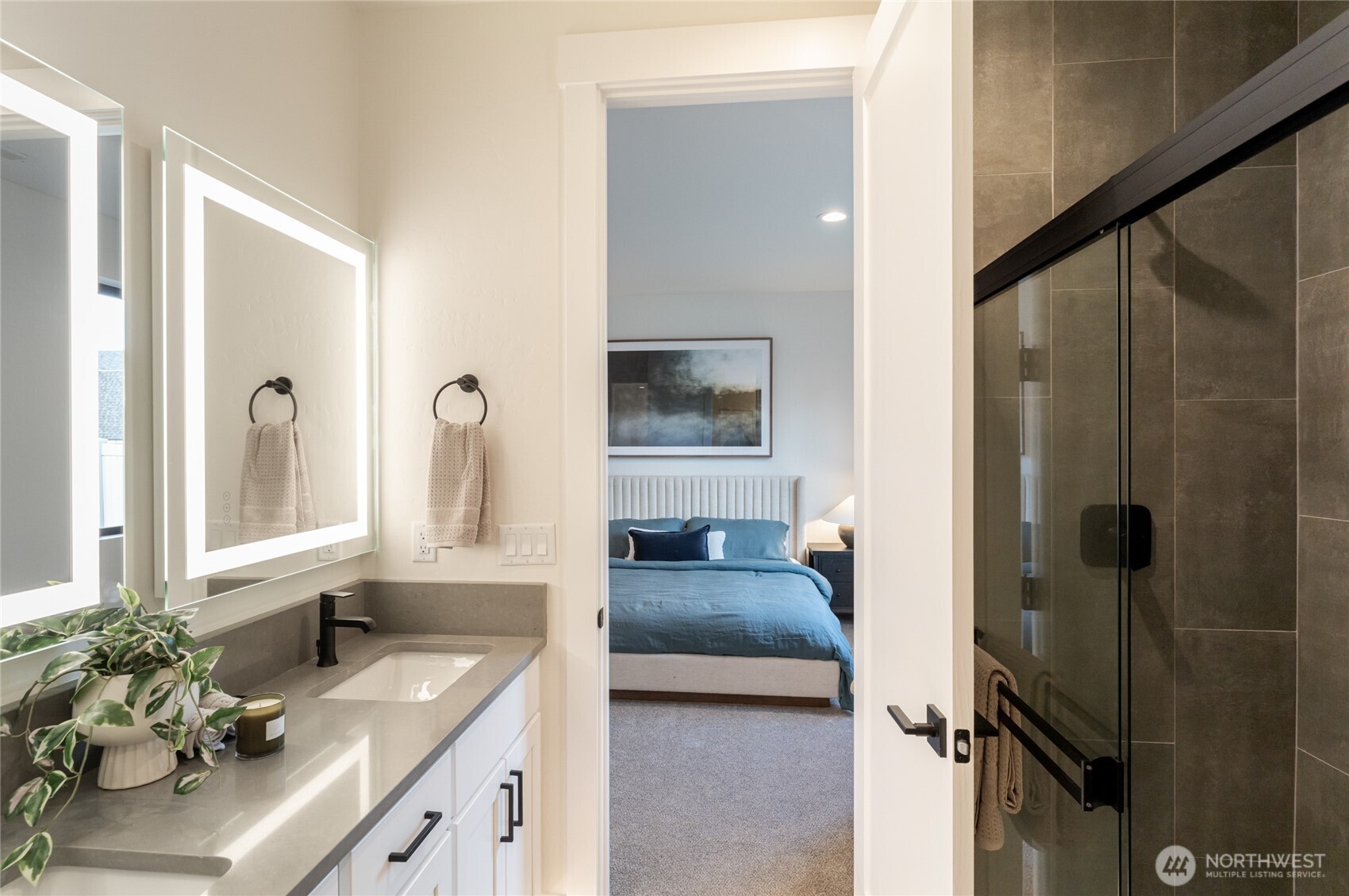 550 South Oasis Loop East Wenatchee, WA 98802 - Photo 26 of 36 a en suite bathroom with a granite countertop sink and a mirror