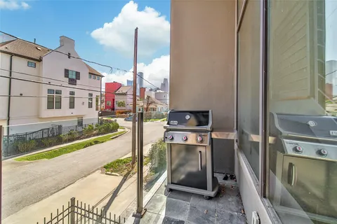 a bathroom with a granite countertop toilet and sink