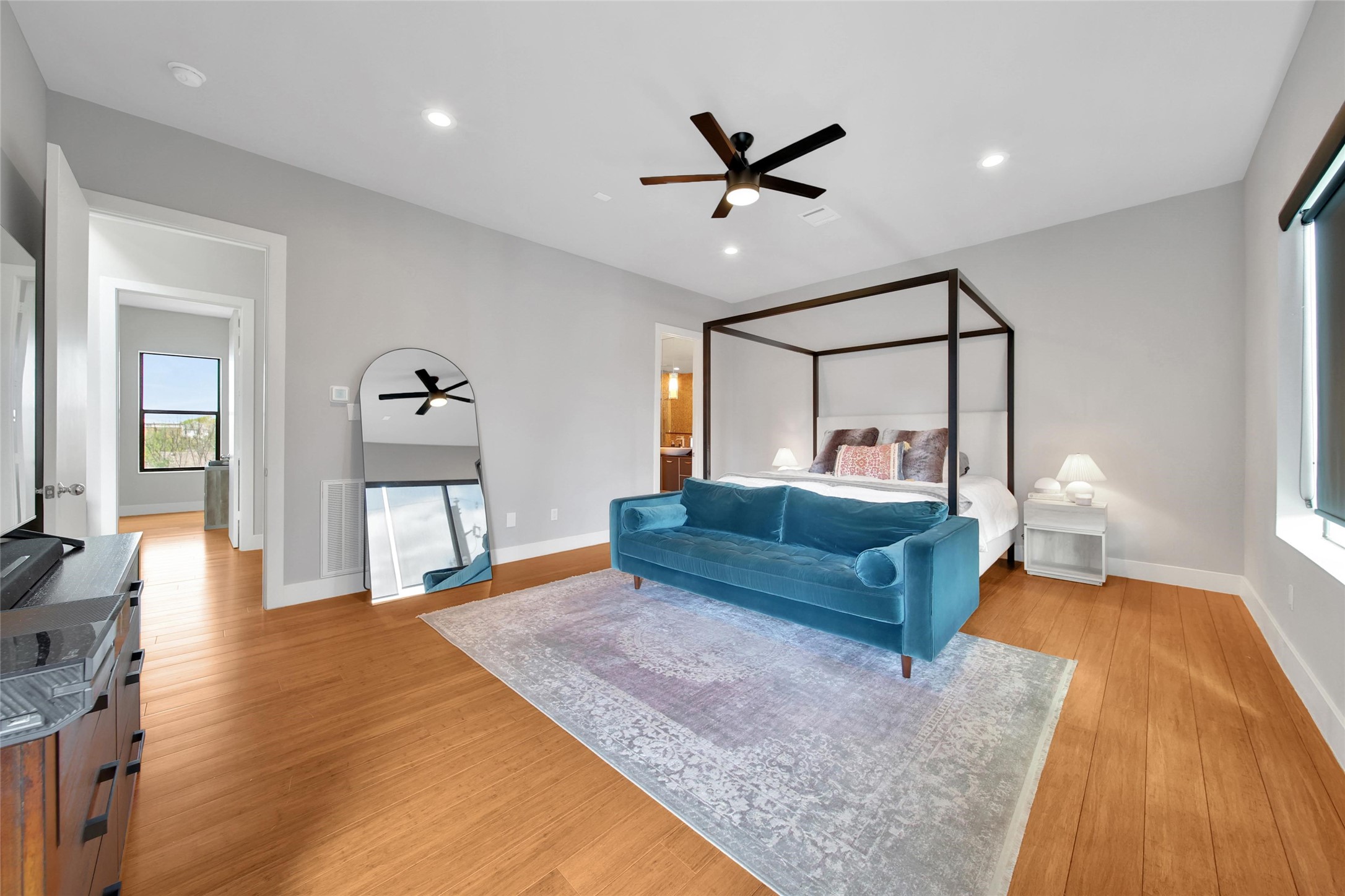 1407 Hickory Street Houston, TX 77007 - Photo 18 of 38 a bedroom with a bed and wooden floor