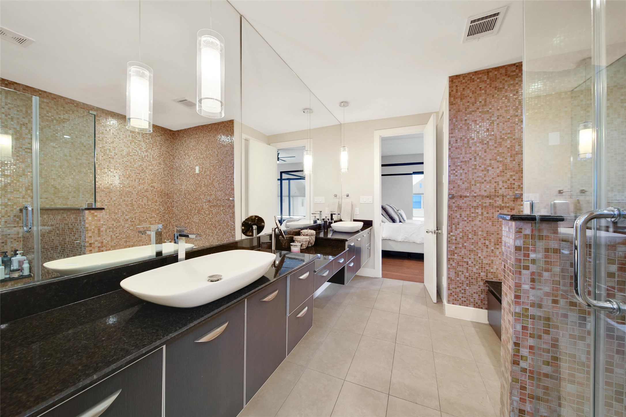 1407 Hickory Street Houston, TX 77007 - Photo 20 of 38 a bathroom with a double vanity sink a mirror and a shower