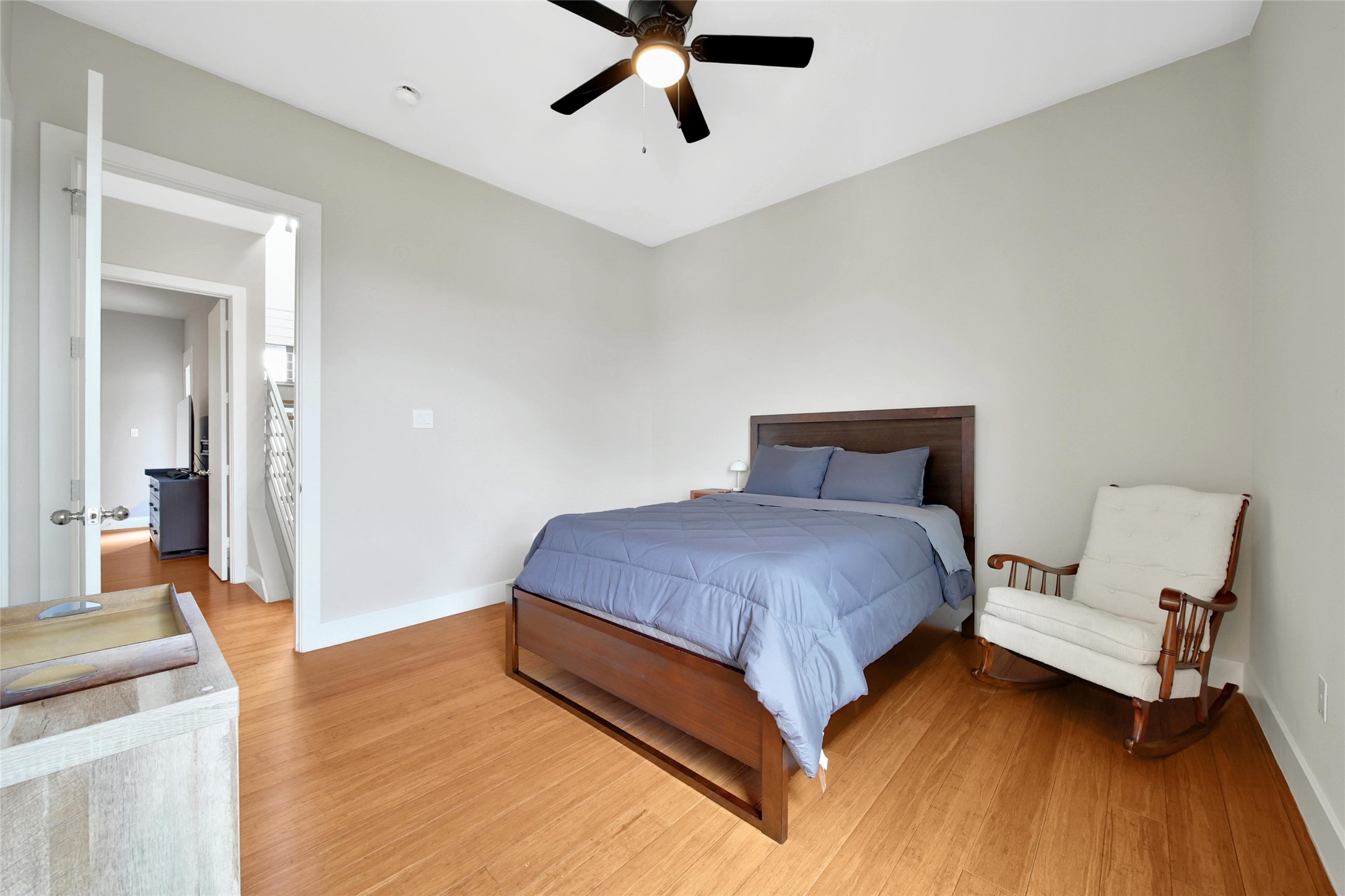 1407 Hickory Street Houston, TX 77007 - Photo 24 of 38 a spacious bedroom with a bed and a dresser
