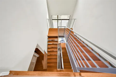 a view of a balcony with wooden floor