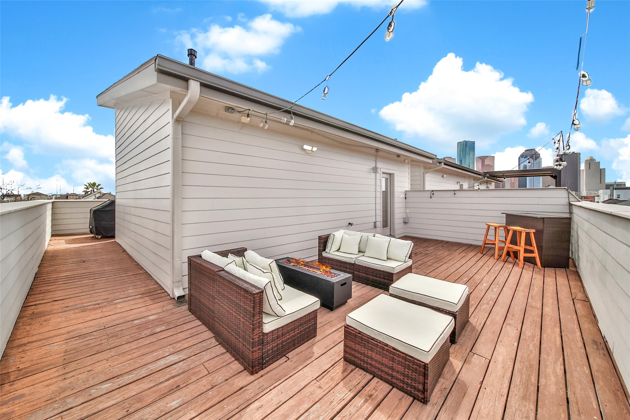 1407 Hickory Street Houston, TX 77007 - Photo 29 of 38 a view of a wooden chairs on roof deck