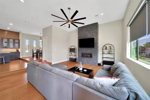 a large kitchen with stainless steel appliances a large counter top