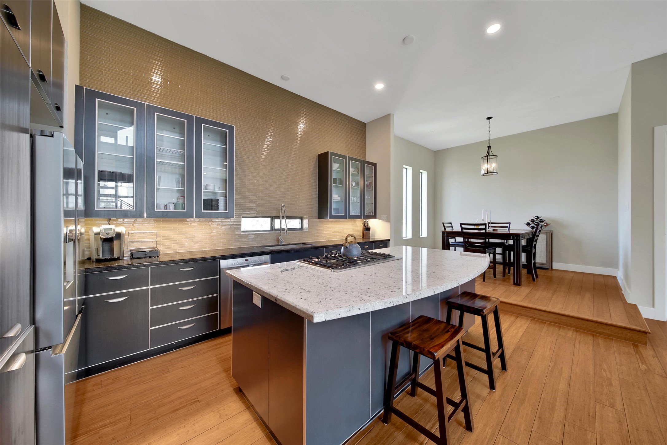 1407 Hickory Street Houston, TX 77007 - Photo 6 of 38 a kitchen with stainless steel appliances granite countertop a sink and a refrigerator