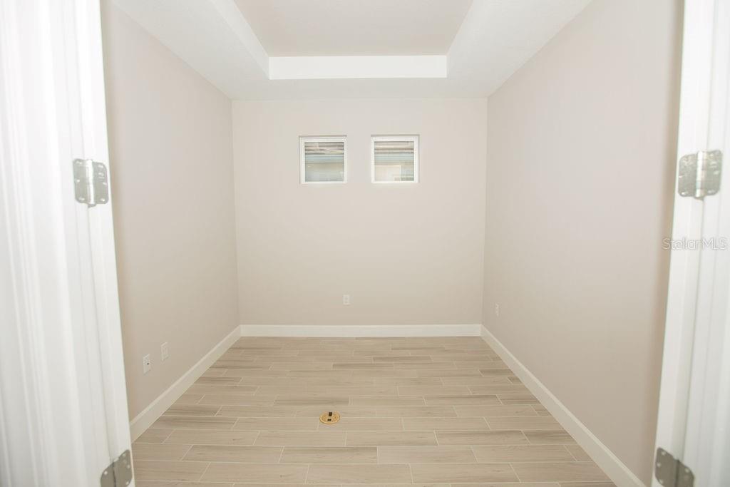 4605 Rosatti Road Wesley Chapel, FL 33543 - Photo 14 of 26 a view of a small space with wooden floor