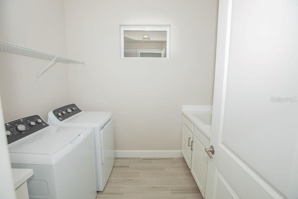 4605 Rosatti Road Wesley Chapel, FL 33543 - Photo 21 of 26 a utility room with dryer and washer