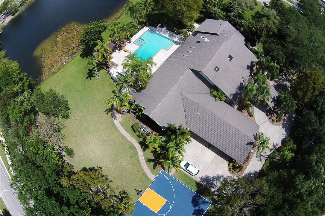 2665 Hackney Road Weston, FL 33331 - Photo 46 of 46 an aerial view of a house with a yard and swimming pool