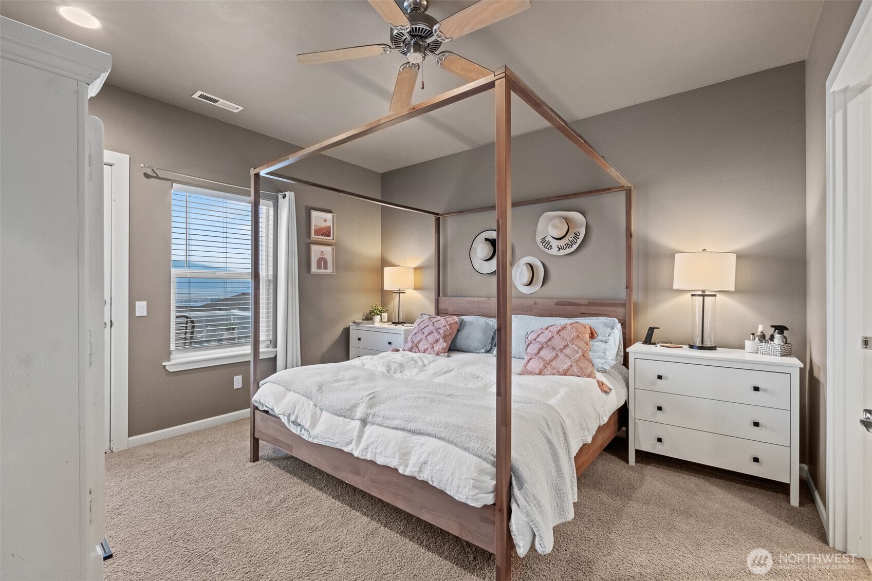 23325 Sunserra Loop, Unit A44 Quincy, WA 98848 - Photo 18 of 34 a bedroom with a large bed and a chandelier