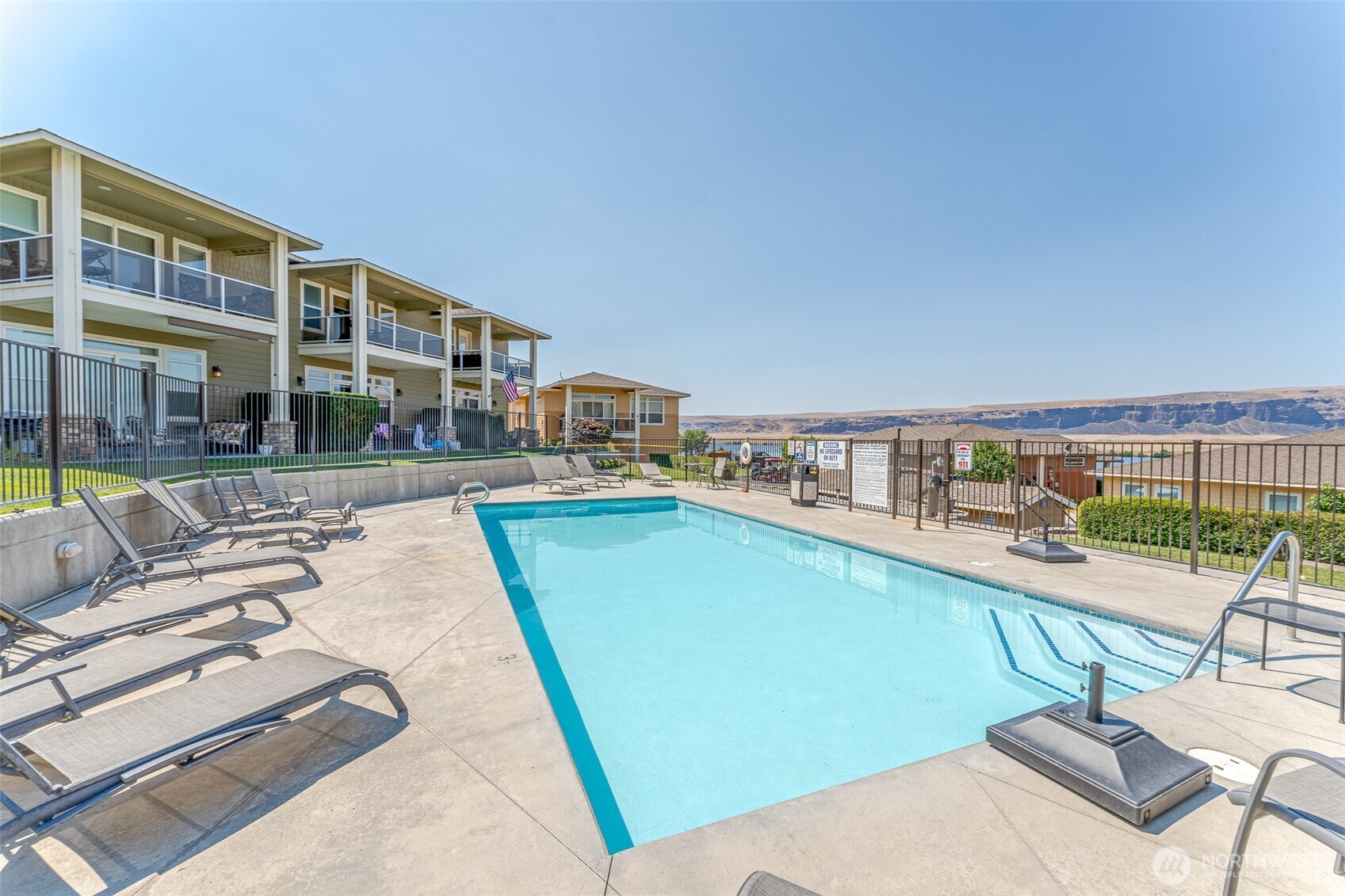 23325 Sunserra Loop, Unit A44 Quincy, WA 98848 - Photo 31 of 34 a view of a swimming pool with a lounge chair