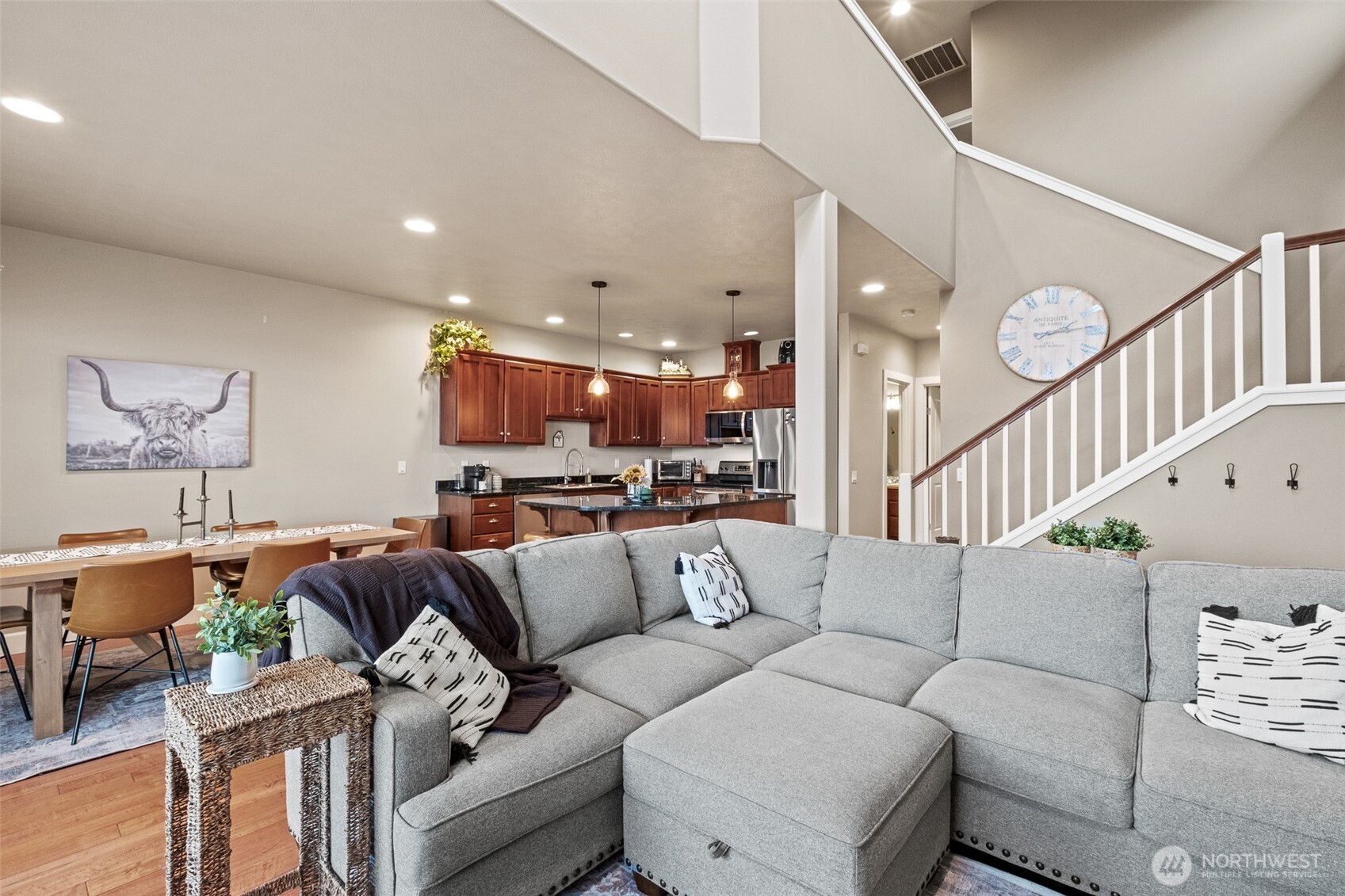 23325 Sunserra Loop, Unit A44 Quincy, WA 98848 - Photo 8 of 34 a living room with furniture kitchen view and a wooden floor