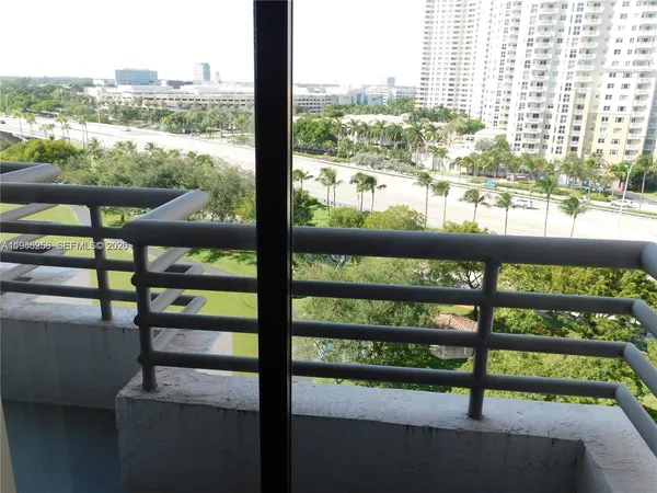 a view of a big yard with table and chairs