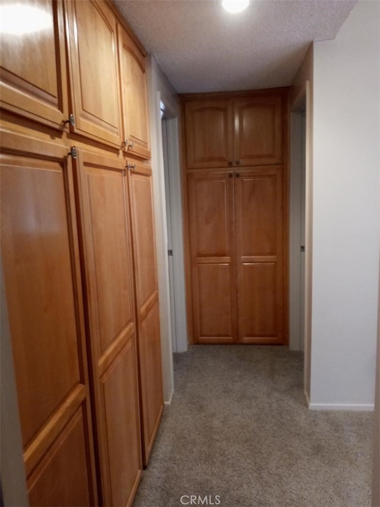 1915 Silver Oak Way Hemet, CA 92545 - Photo 13 of 18 Hallway with Ample Storage Cupboards