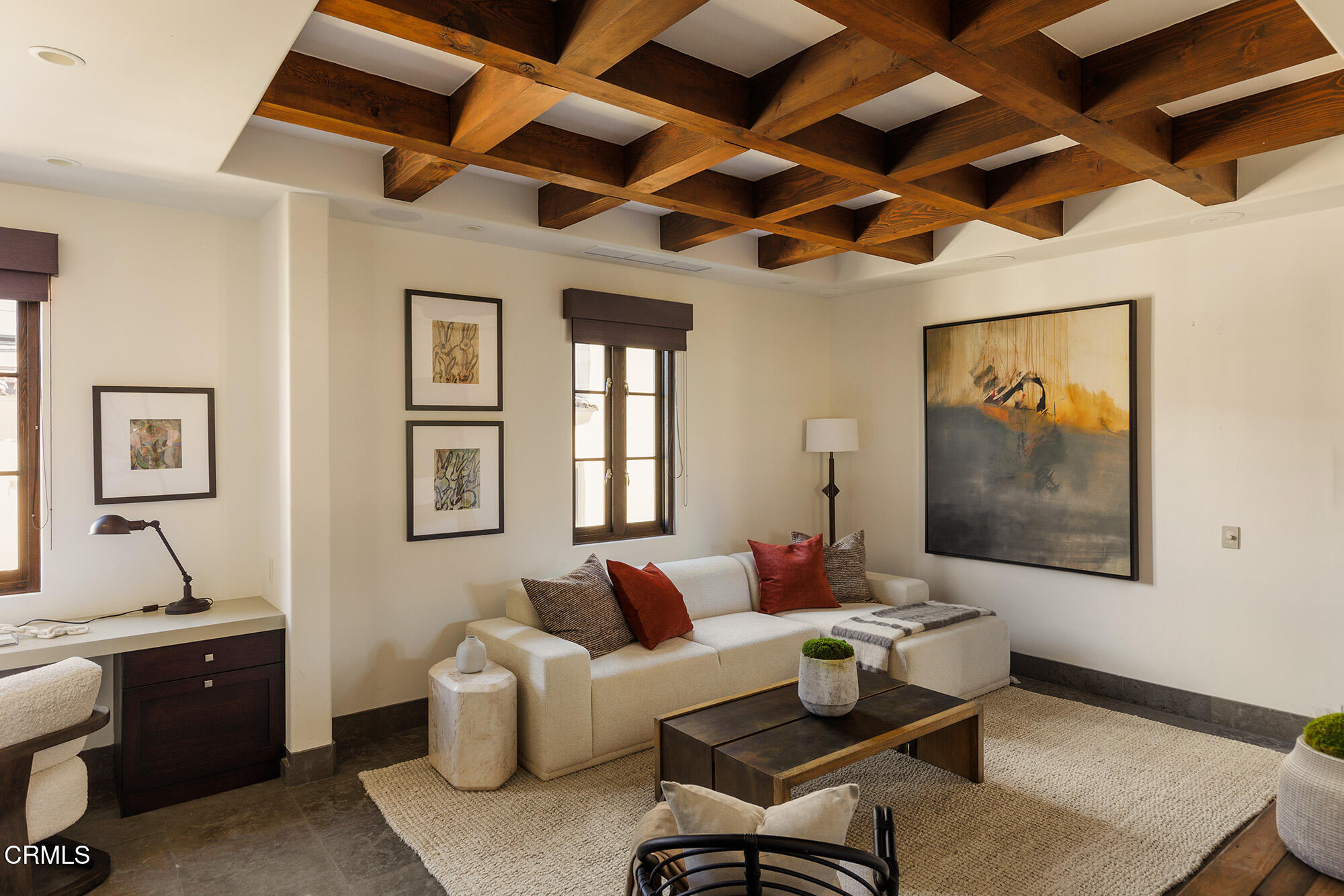 72265 Bajada Trail Palm Desert, CA 92260 - Photo 12 of 25 a living room with furniture two windows and a flat screen tv