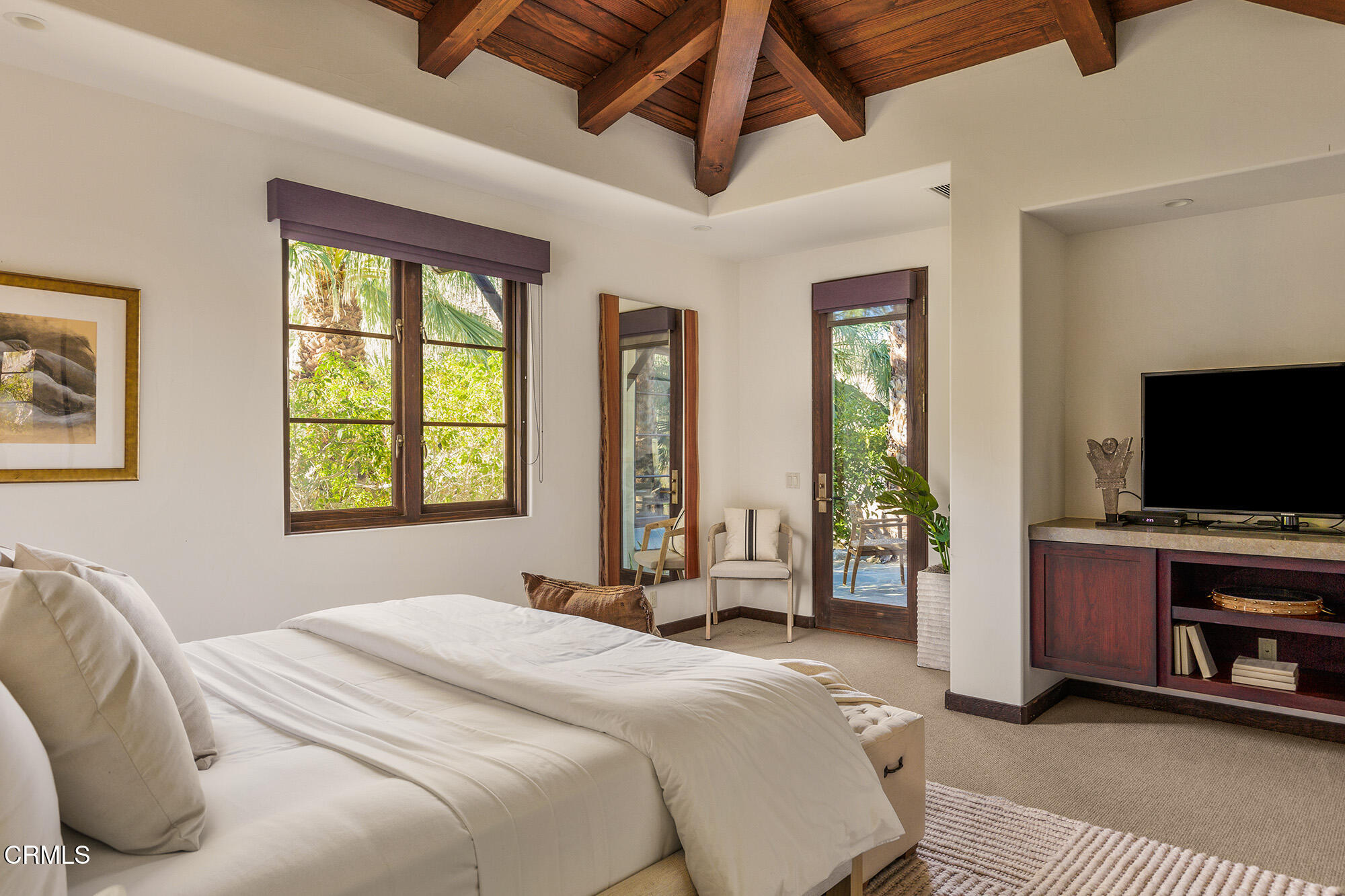 72265 Bajada Trail Palm Desert, CA 92260 - Photo 15 of 25 a bedroom with a bed and a flat screen tv