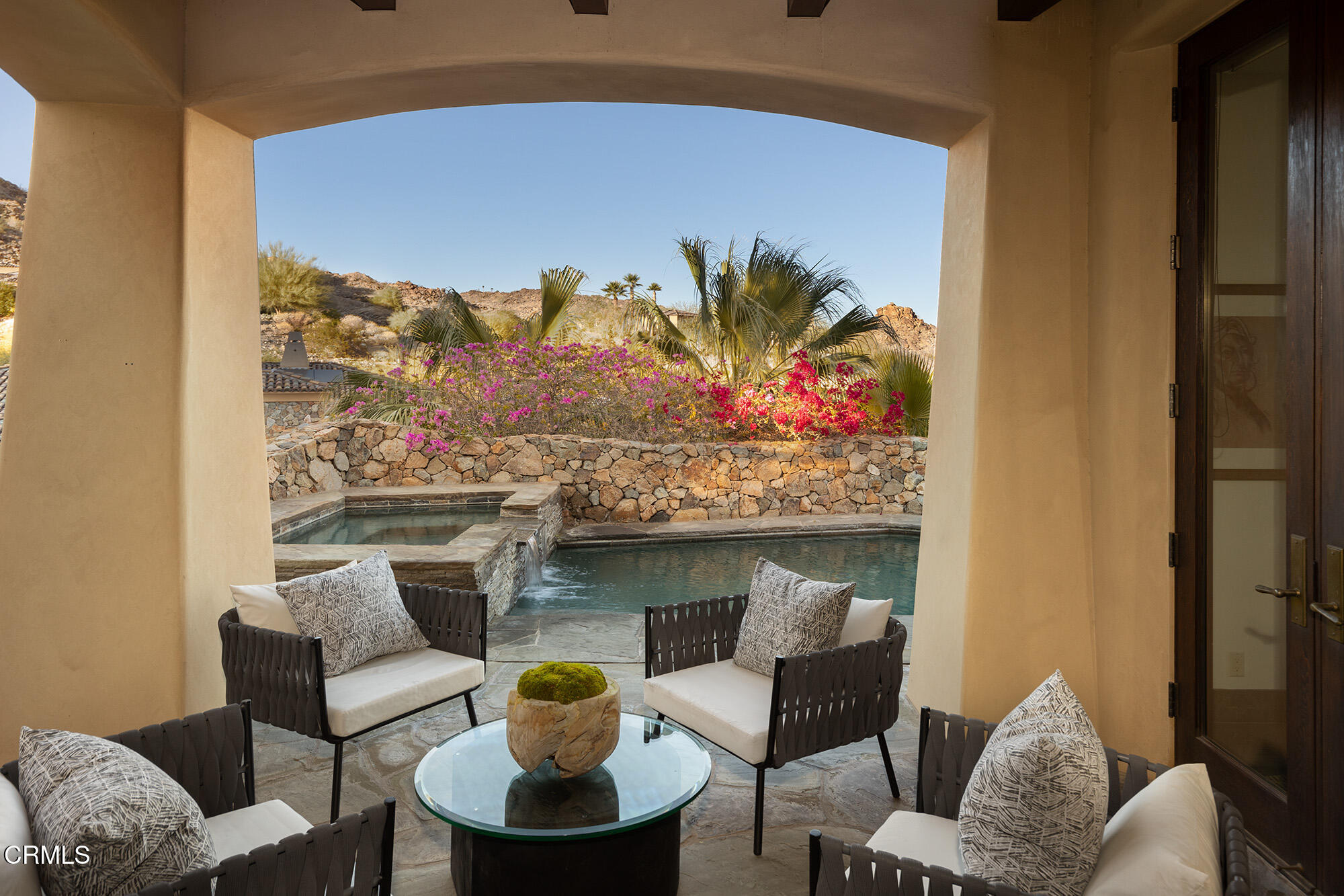 72265 Bajada Trail Palm Desert, CA 92260 - Photo 3 of 25 a balcony with furniture and painting on the wall