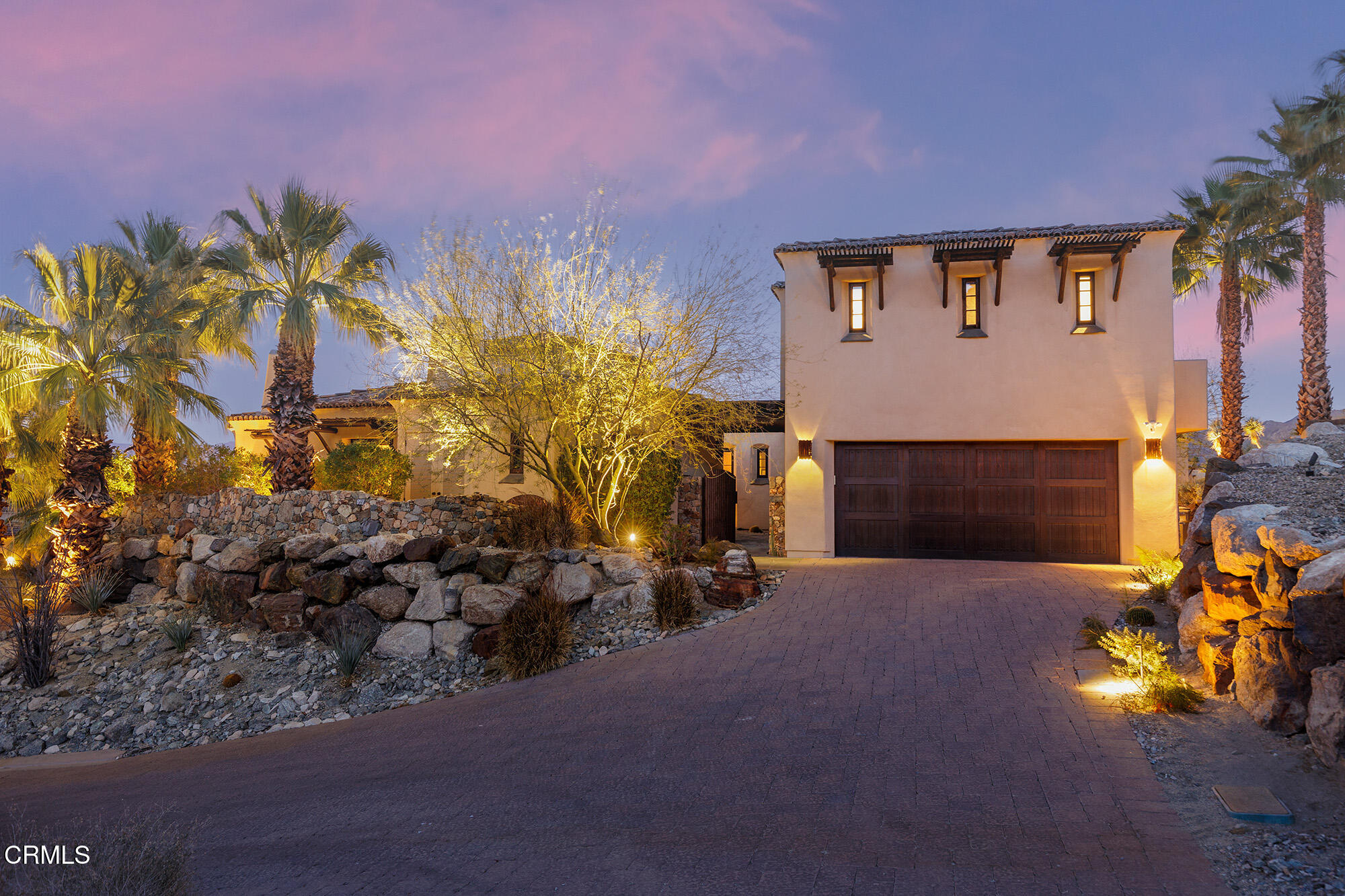 72265 Bajada Trail Palm Desert, CA 92260 - Photo 5 of 25 a front view of a house with a yard
