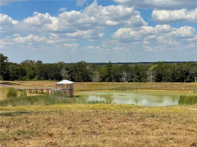 a view of an swimming pool and a yard