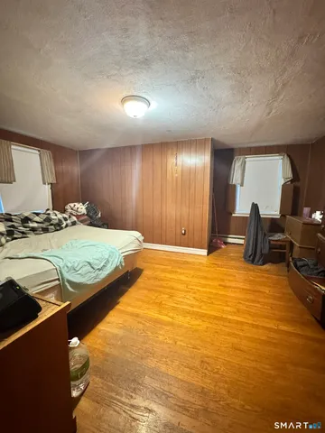 a bedroom with a bed and gym equipment