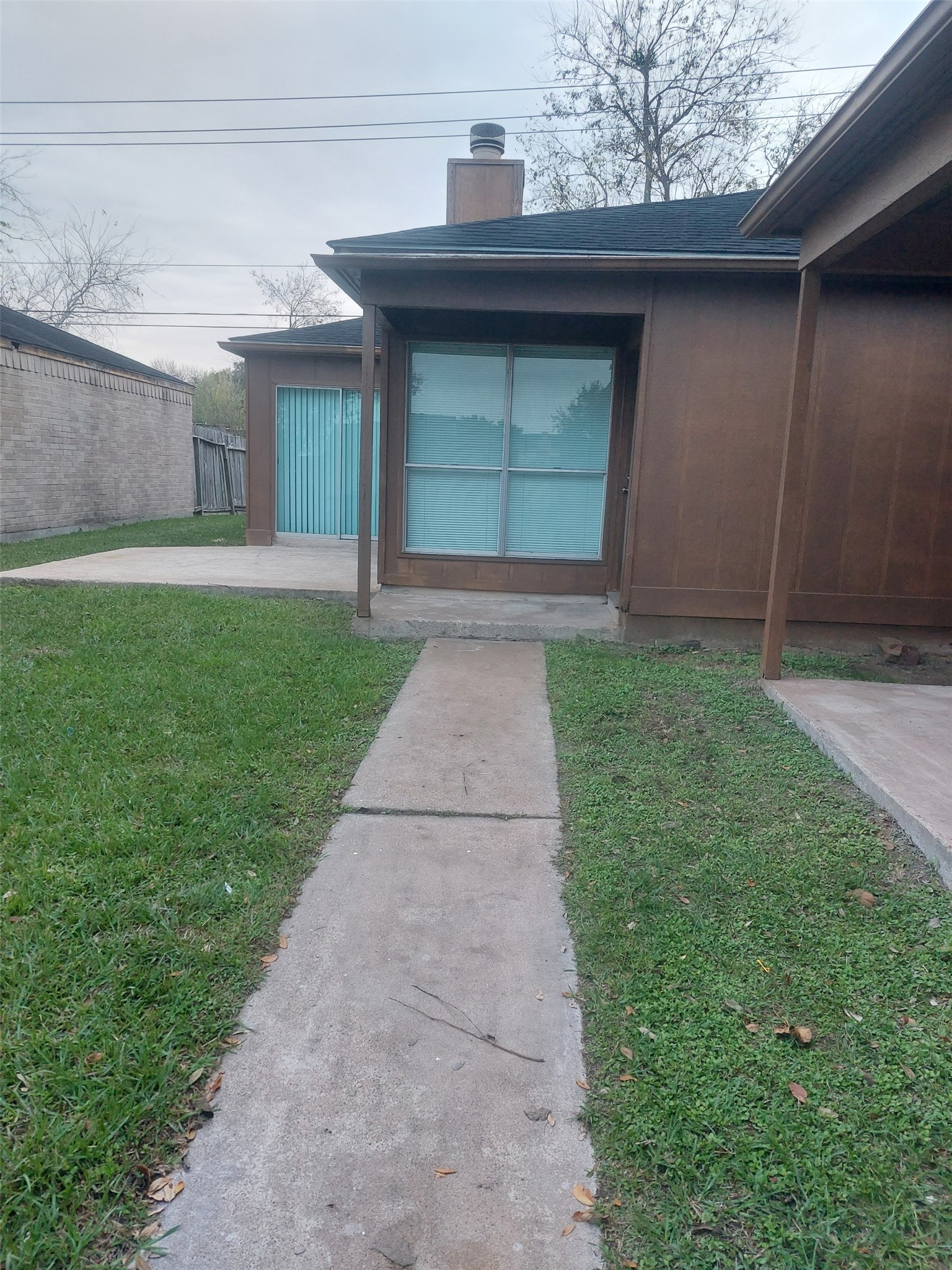 8151 Misty Ridge Lane Houston, TX 77071 - Photo 2 of 15 a front view of a house with a yard and garage