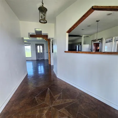 a view of a livingroom with furniture and window