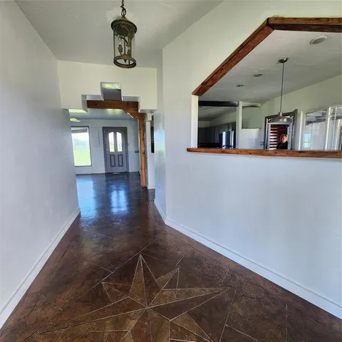 a view of a livingroom with furniture and window