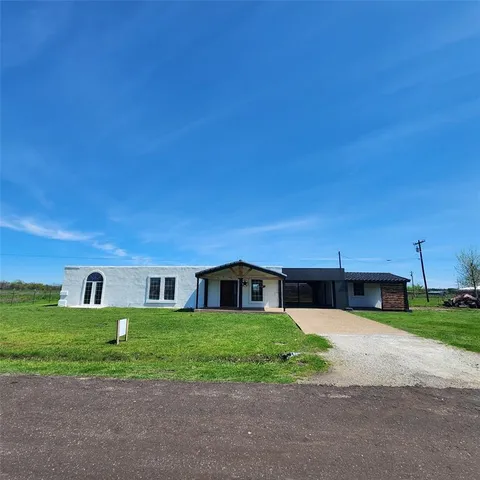 a house view with a garden space
