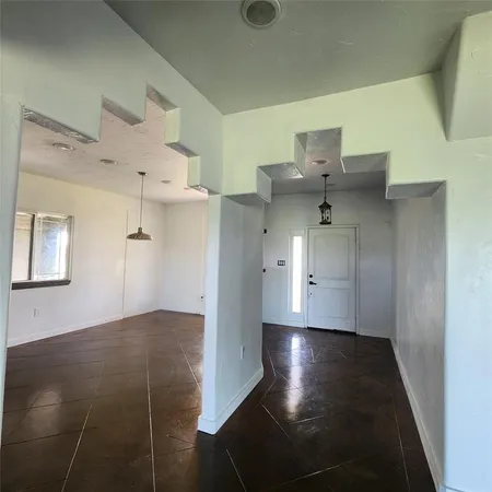 a view of a hallway with entryway