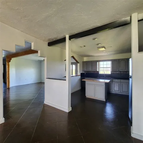 a view of kitchen with furniture and wooden floor