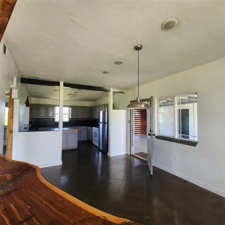 a view of a living room with furniture wooden floor and window