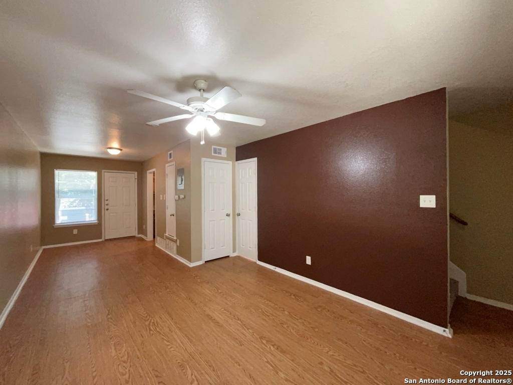 2802 Lasses Boulevard, Unit 42 San Antonio, TX 78223 - Photo 12 of 33 an empty room with windows and fan