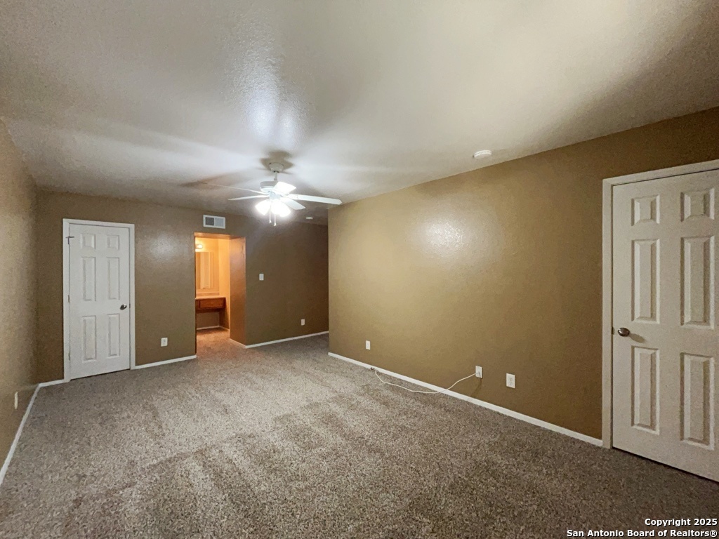 2802 Lasses Boulevard, Unit 42 San Antonio, TX 78223 - Photo 19 of 33 an empty room with closet and fan