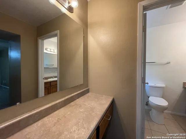 a bathroom with a bathtub and a toilet