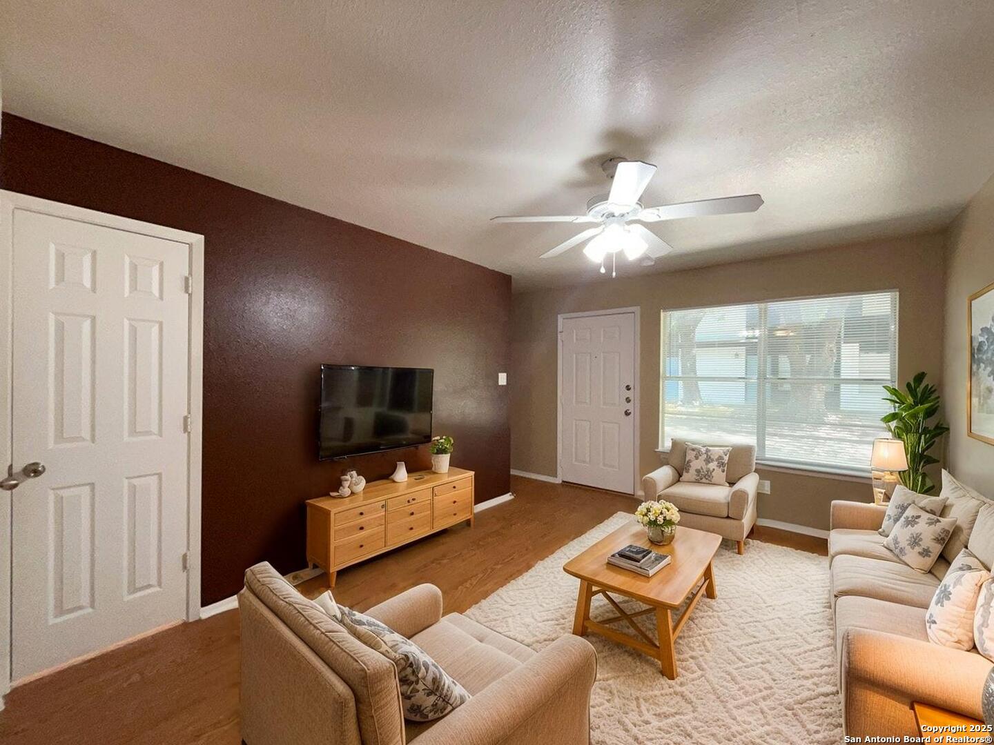 2802 Lasses Boulevard, Unit 42 San Antonio, TX 78223 - Photo 3 of 33 a living room with furniture and a flat screen tv