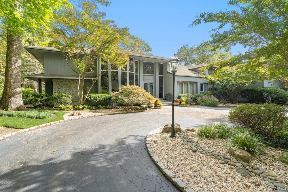 8 Forest Court Syosset, NY 11791 - Photo 1 of 40 View of front of property featuring stone siding and circular driveway