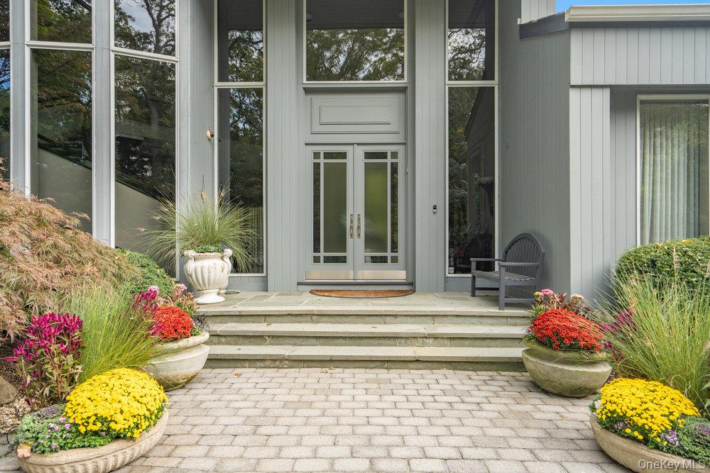 8 Forest Court Syosset, NY 11791 - Photo 2 of 40 View of exterior entry with walls of glass featuring french doors