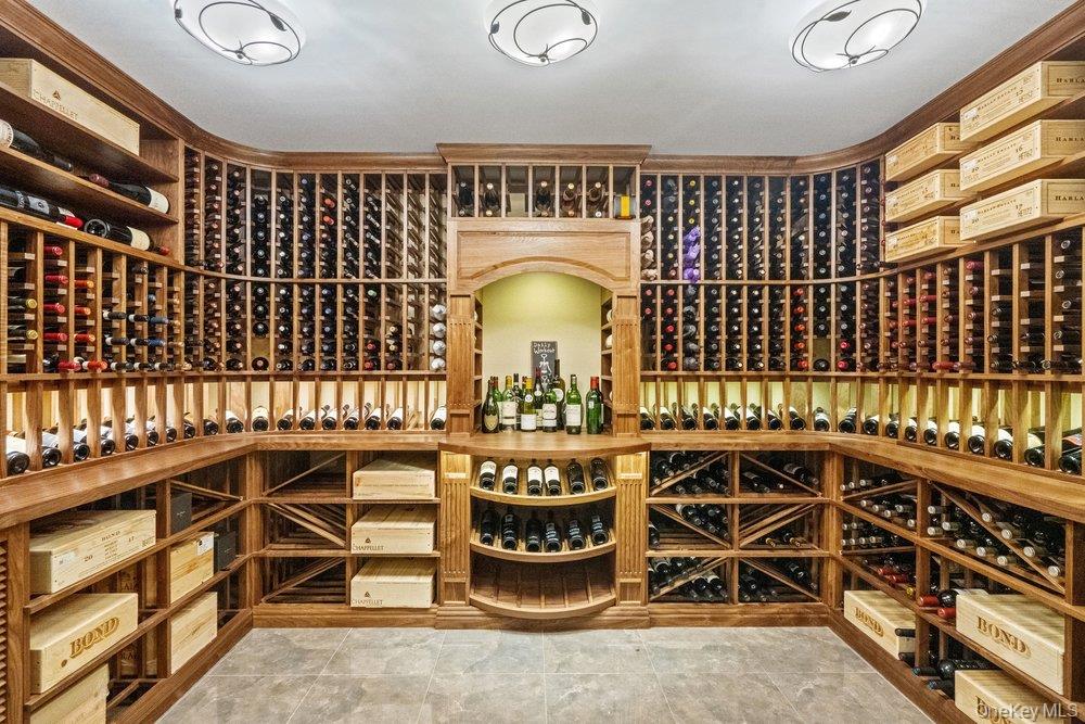 8 Forest Court Syosset, NY 11791 - Photo 24 of 40 View of temperature controlled custom wine room with floor to ceiling shelving
