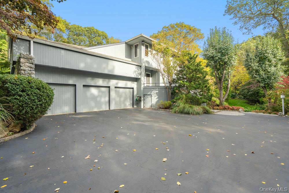 8 Forest Court Syosset, NY 11791 - Photo 39 of 40 View of 3 car garage and one entrance to backyard