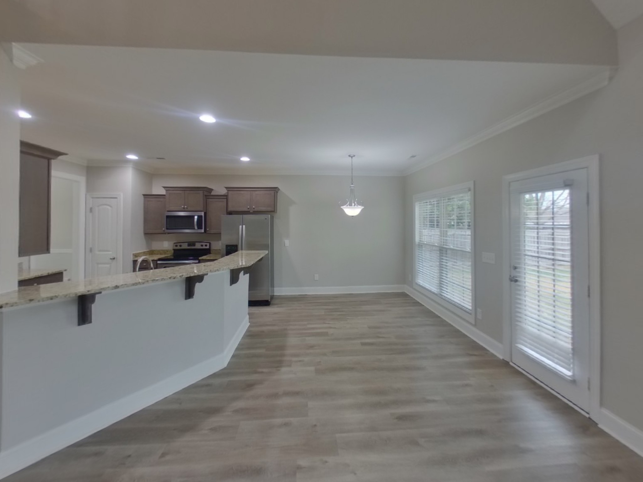 1502 John Lee Lane Murfreesboro, TN 37128 - Photo 5 of 15 a kitchen with stainless steel appliances a refrigerator and white cabinets