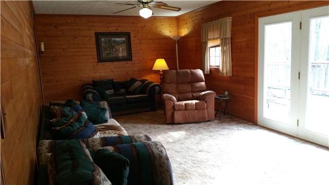 9035 Alex Goins Road Lyles, TN 37098 - Photo 11 of 20 Separate living room off of hallway. Double doors leading to the deck and beautiful view.